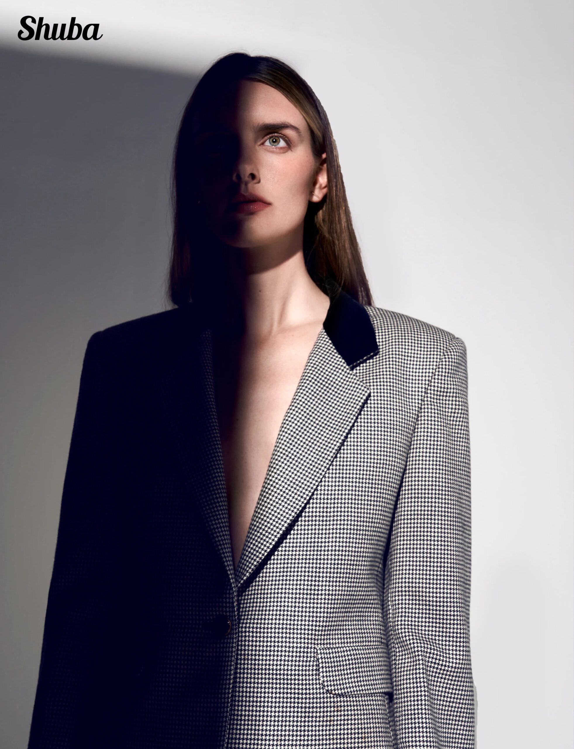 Model in an oversized grey houndstooth blazer with a black velvet lapel